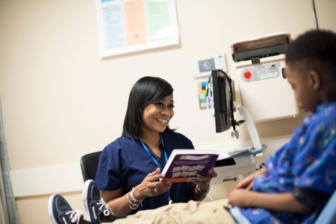 The West Philadelphia Skills Initiative (WPSI) | A graduate working as a patient sitter