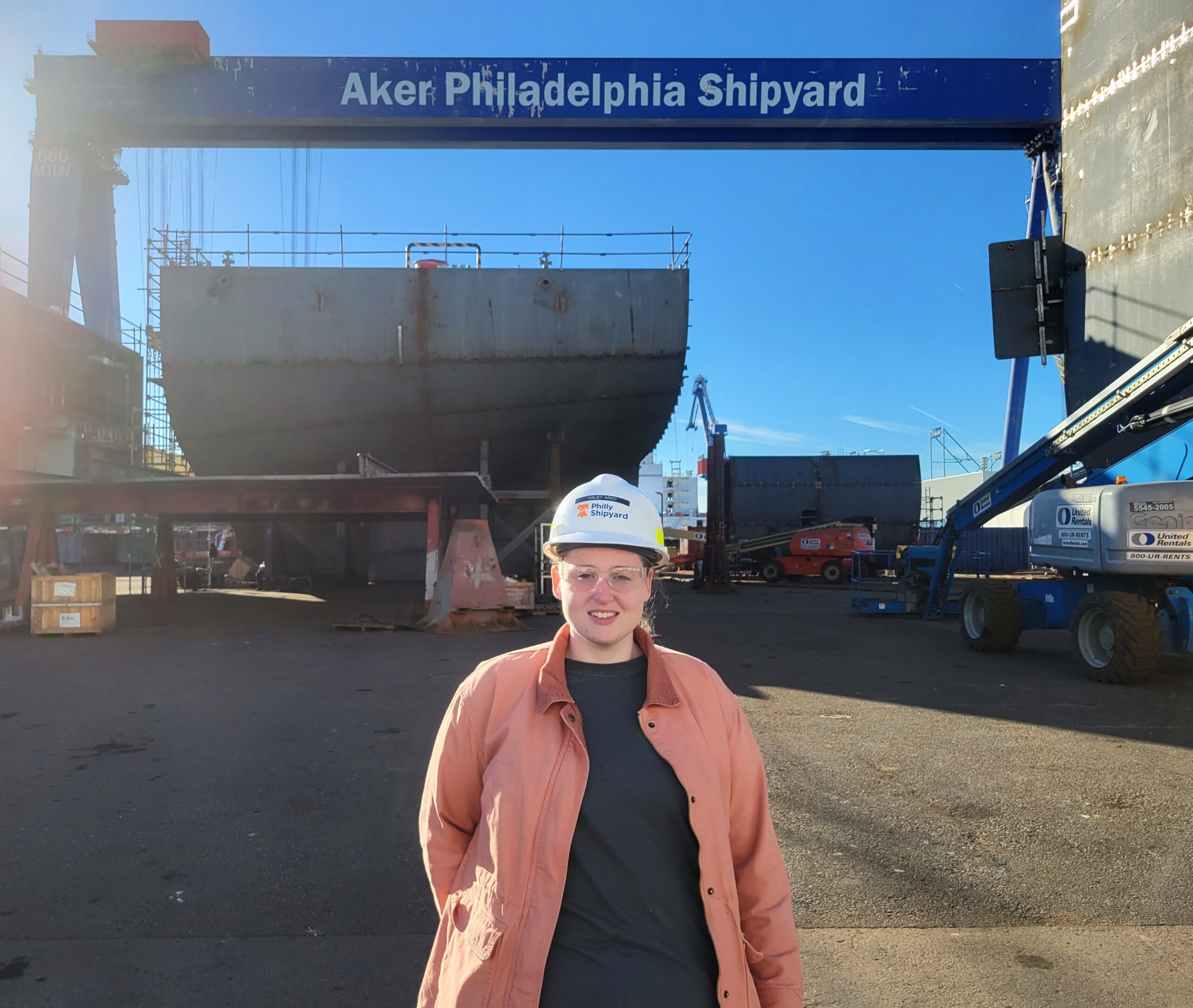 Haley stands under the Aker Philadelphia Shipyard crane at the Philadelphia Navy Yard