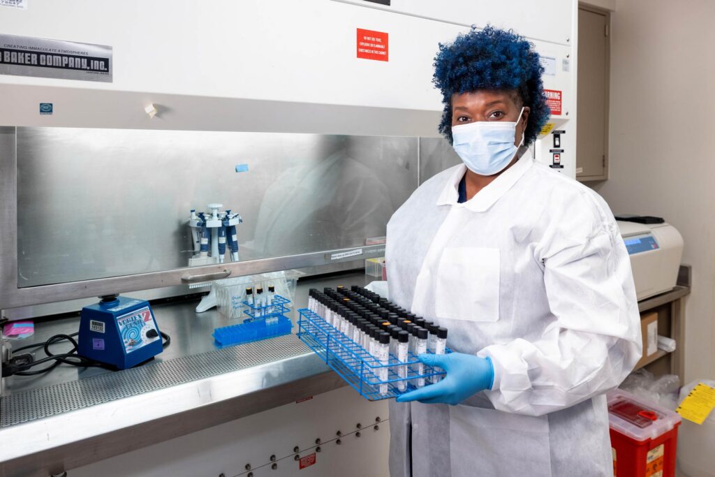 Skills Initiative graduate in a laboratory.