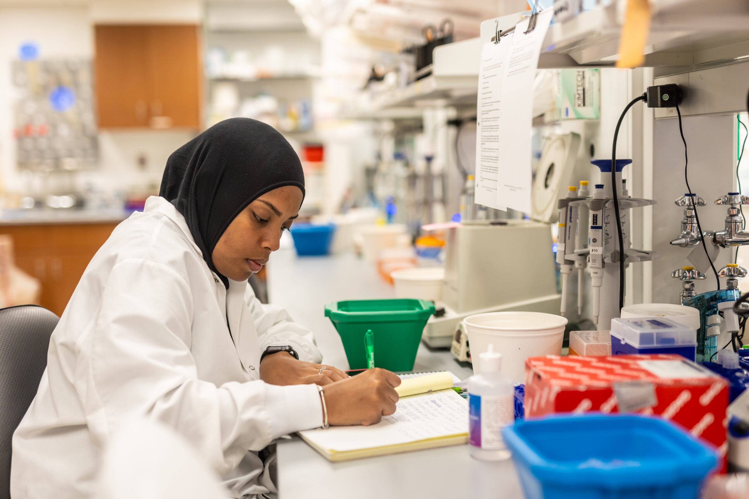 A laboratory technician works in a lab at Wistar.